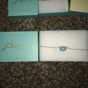 Teal stone necklace with gold colored chain